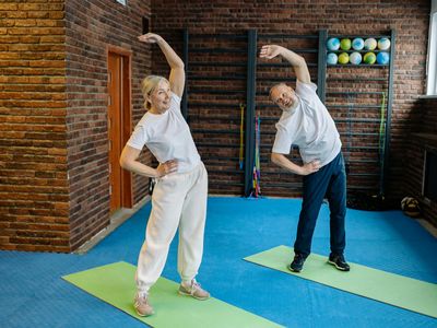 Stretching exercises in a dark room.